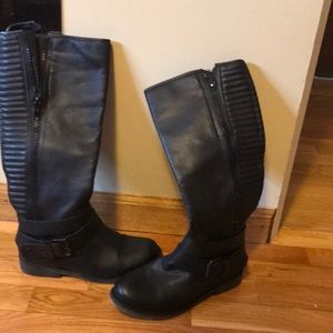 Tall black riding boots